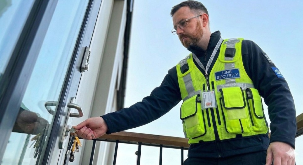 Security officer securing a commercial door